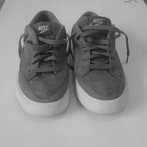 Gray and white Nike's